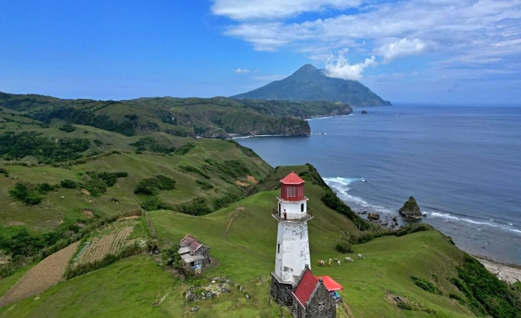 Tayid Lighthouse on rolling green hills in Batanes, Philippines