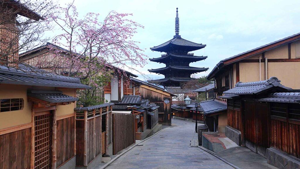 Traditional streets of Higashiyama district in Kyoto with Yasaka pagoda in background