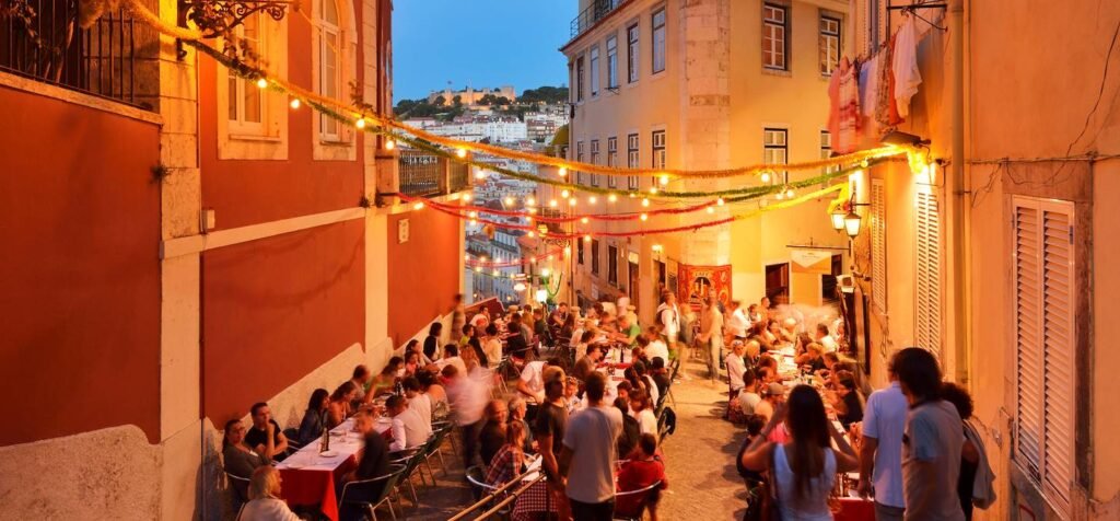 Bairro Alto street festival with crowds and string lights in Lisbon