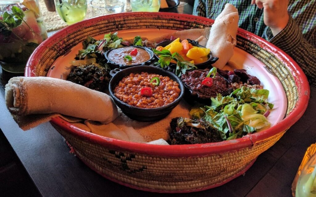Ethiopian vegan fasting platter with injera and lentil stews
