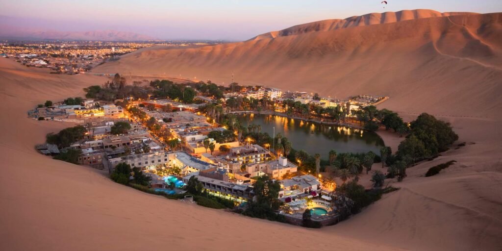 Panoramic view of Huacachina oasis at sunset