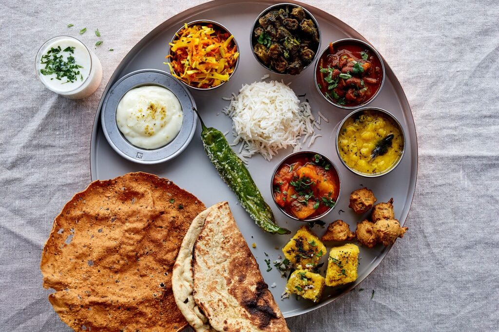 Indian vegetarian thali with rice, dal and side dishes