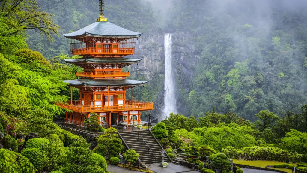 Japanese pagoda with waterfall — Japan long haul travel for every budget tier