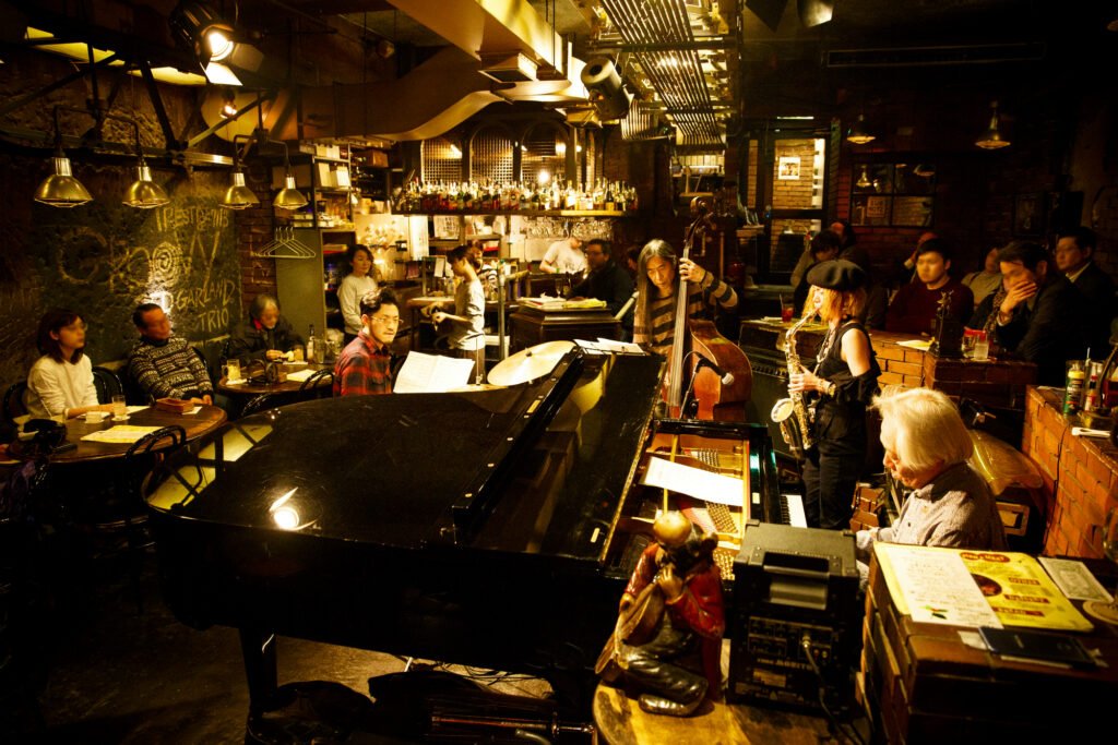Live jazz musicians performing at an intimate jazz bar in Tokyo