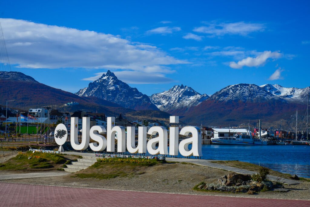 Ushuaia welcome sign with Beagle Channel - Patagonia Argentina end of the world travel