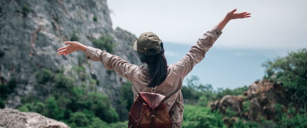 traveler feeling free and relaxed on a slow trip - wellbeing benefits of slow travel