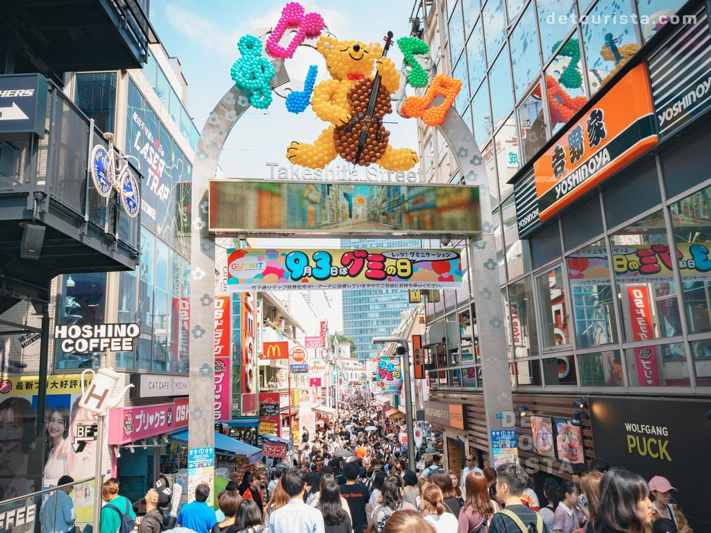 Takeshita Street entrance in Harajuku Tokyo with colorful fashion shops and crowds - Japan travel guide