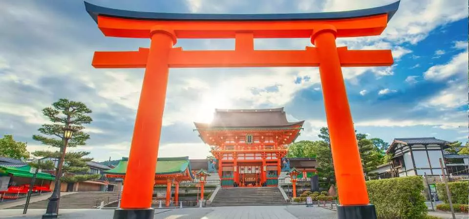Red torii gates at Fushimi Inari Taisha shrine in Kyoto - Japan travel guide