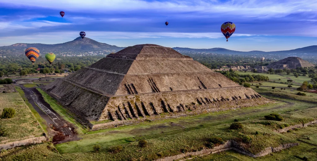 Pyramid of the Sun at Teotihuacan with hot air balloons above, near Mexico City