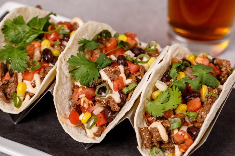 Tacos de barbacoa with cilantro and salsa, traditional street food in Mexico City